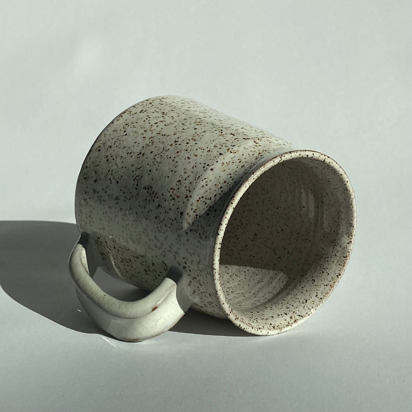 Waxy White Speckled Mug with Smooth Brown Handle