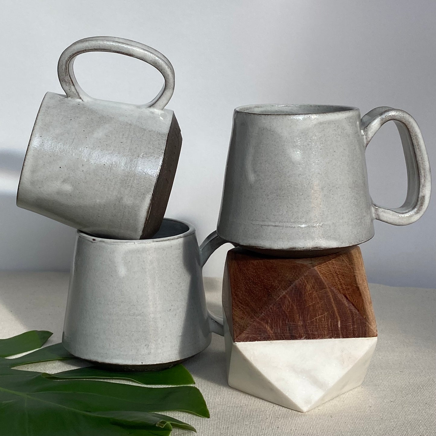 Small Dark Brown Mugs in Waxy White Glaze