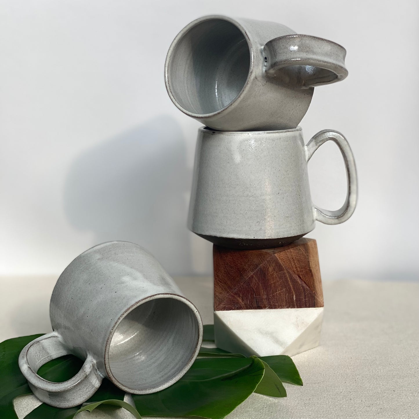 Small Dark Brown Mugs in Waxy White Glaze