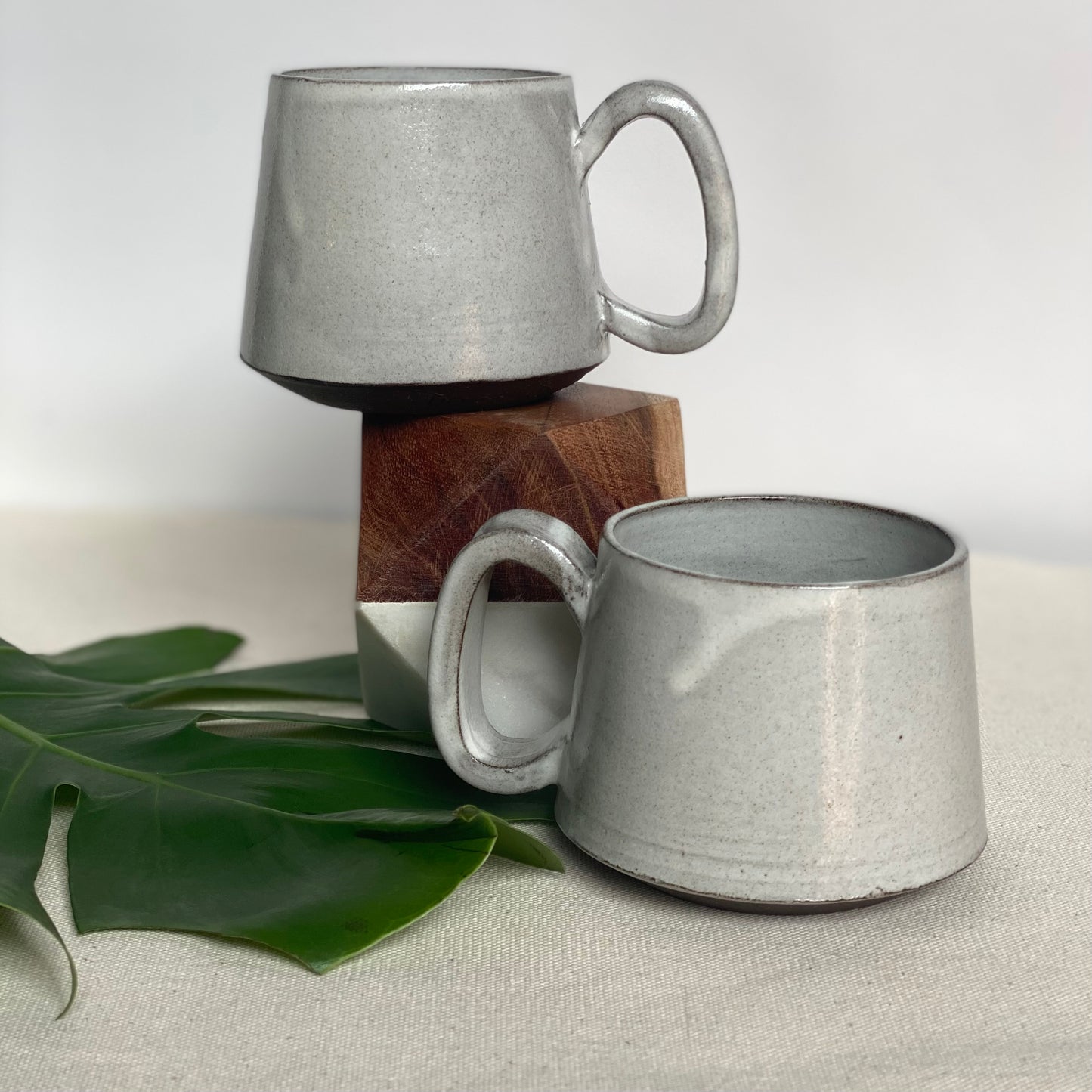 Medium Dark Brown Mugs in Waxy White Glaze