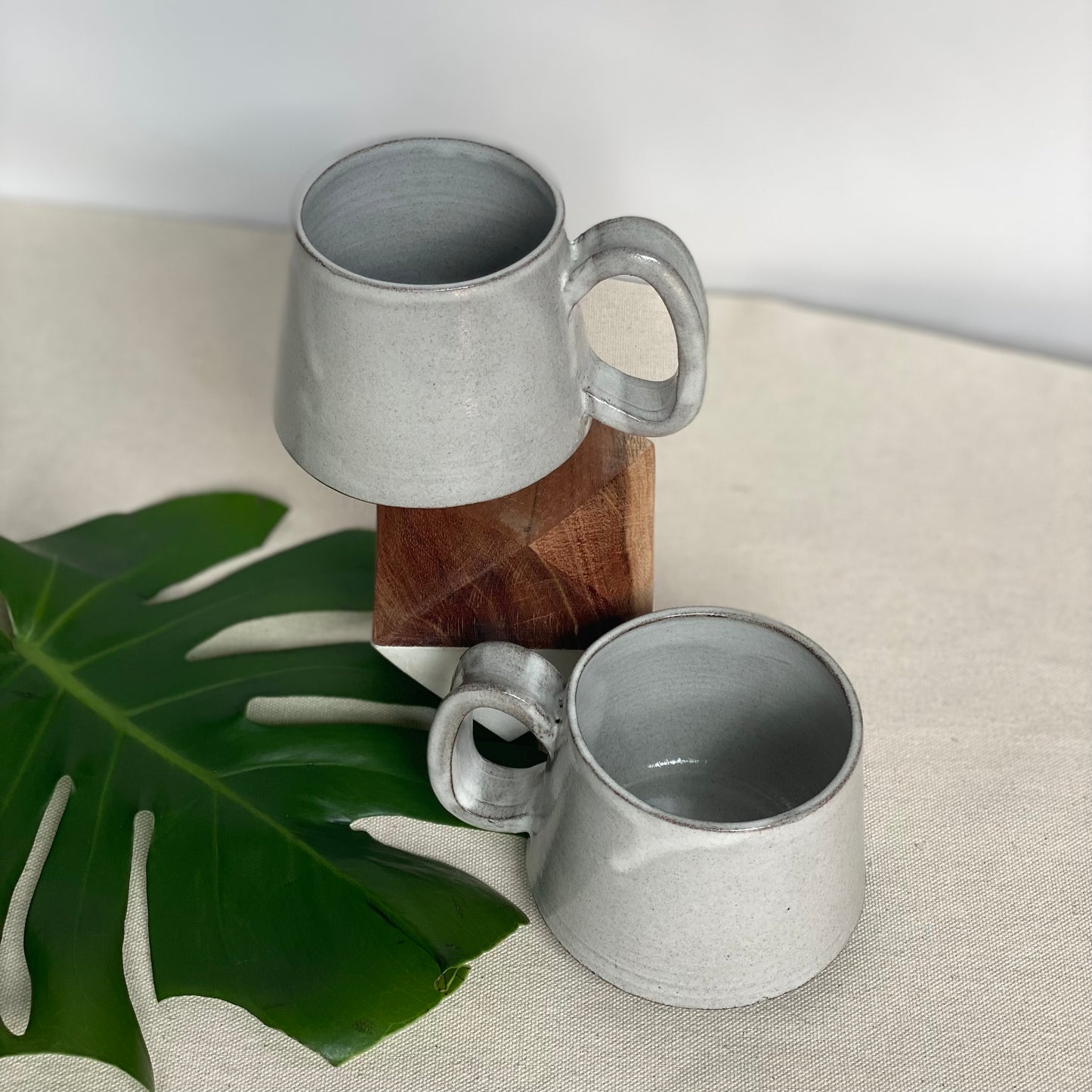 Medium Dark Brown Mugs in Waxy White Glaze