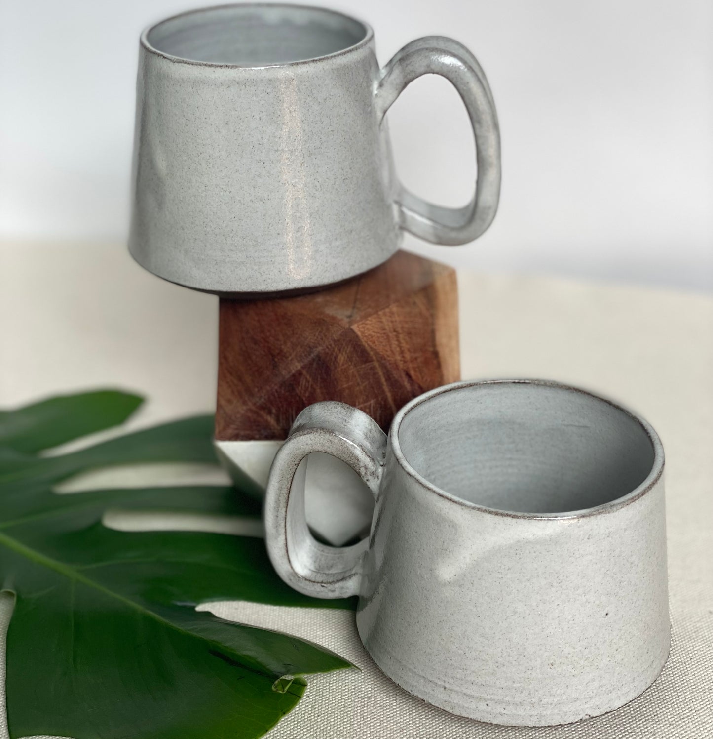 Medium Dark Brown Mugs in Waxy White Glaze
